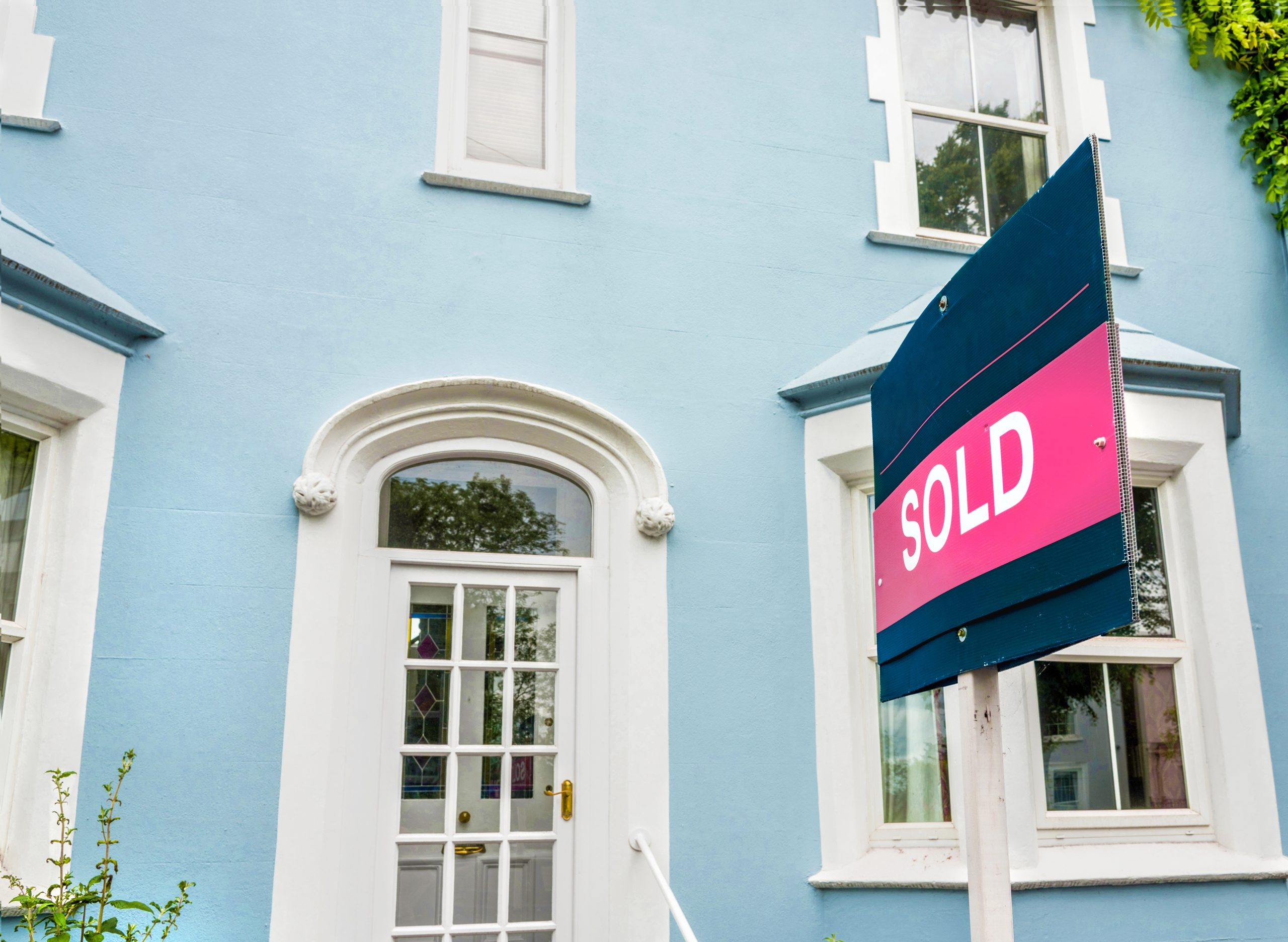 Sold sign in front of blue house The Most Overlooked Checks When Viewing a Property